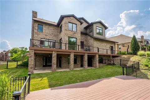 a view of a house with a yard and plants