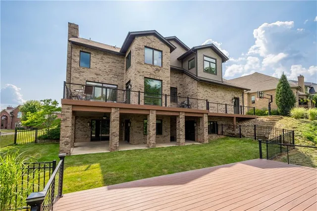 a view of a house with a yard and plants