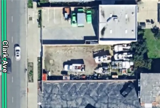 a view of a house with a wooden fence