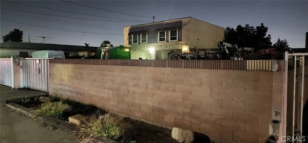 a view of a balcony with wooden fence