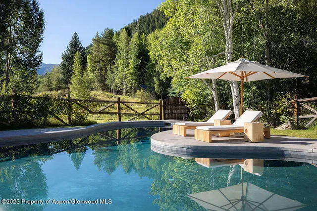 a bathroom with a toilet sink and shower