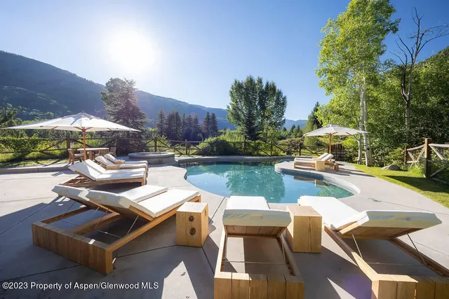 a bedroom with a bed and a flat screen television