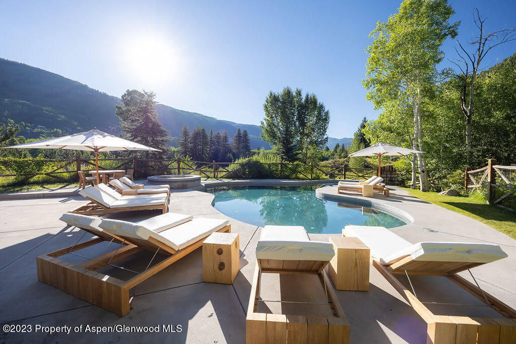 1490 Ute Avenue Aspen, CO 81611 - Photo 18 of 82 a view of a patio with chairs and a table