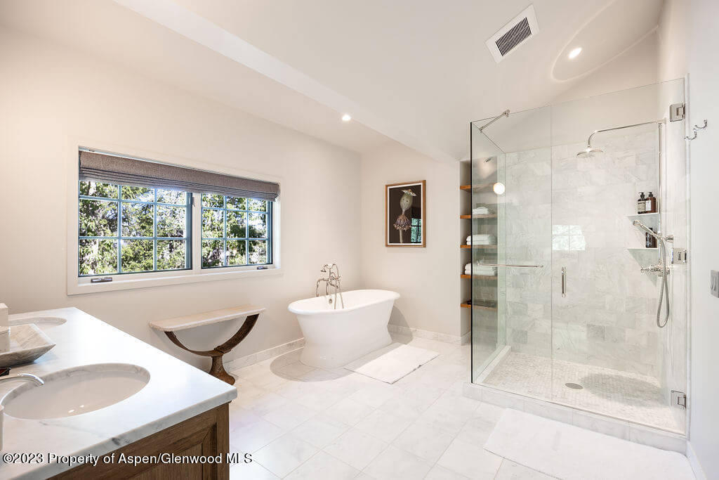 1490 Ute Avenue Aspen, CO 81611 - Photo 24 of 82 a bathroom with a tub sink shower and mirror