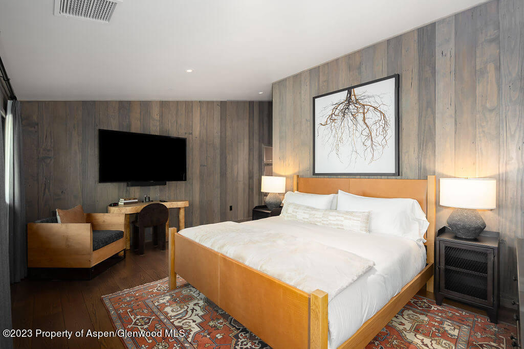 1490 Ute Avenue Aspen, CO 81611 - Photo 25 of 82 a bedroom with a bed and a flat screen television