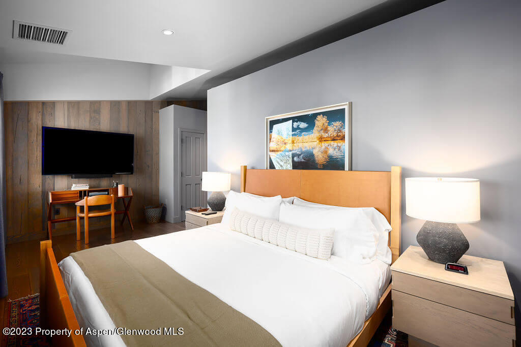 1490 Ute Avenue Aspen, CO 81611 - Photo 26 of 82 a bedroom with a bed and a flat screen tv