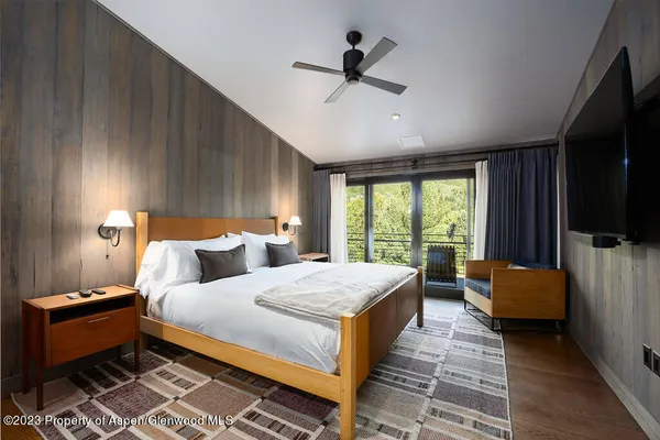 an aerial view of house with yard swimming pool and mountain view in back