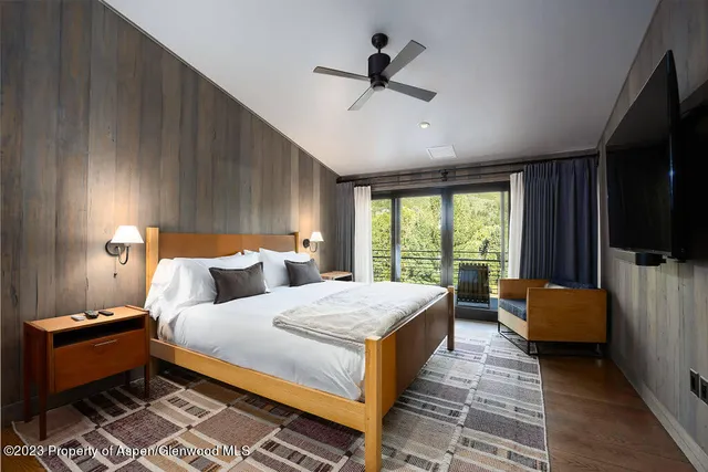 an aerial view of house with yard swimming pool and mountain view in back