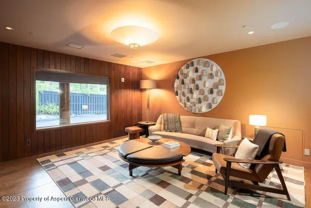 a bedroom with a bed and the view of en suite bathroom