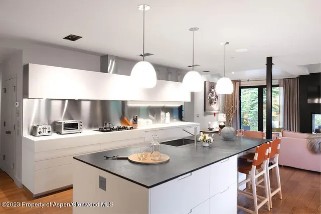 a bed room with a bed and a large window