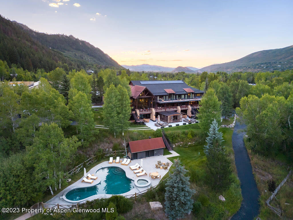 1490 Ute Avenue Aspen, CO 81611 - Photo 47 of 82 an aerial view of house with yard swimming pool and mountain view in back