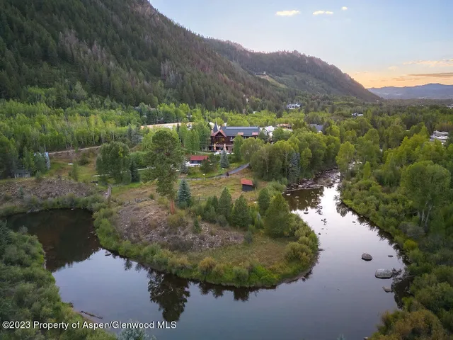 a living room with lots of furniture and a table