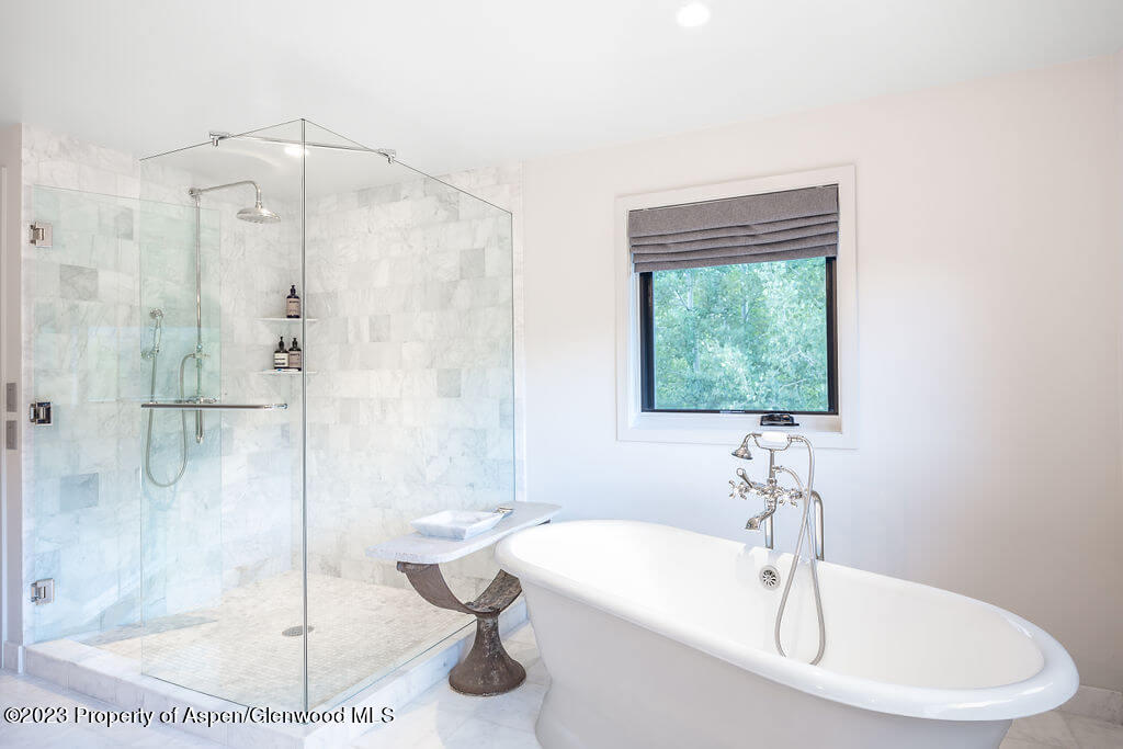 1490 Ute Avenue Aspen, CO 81611 - Photo 9 of 82 a bathroom with a sink and a shower
