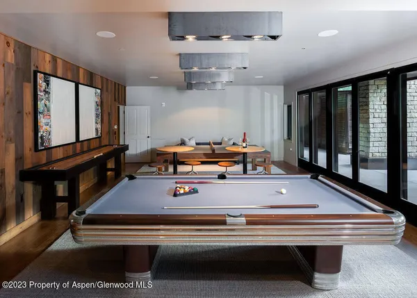 a view of a patio with table and chairs and potted plants