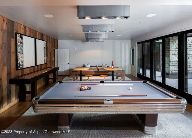 a view of a patio with table and chairs and potted plants