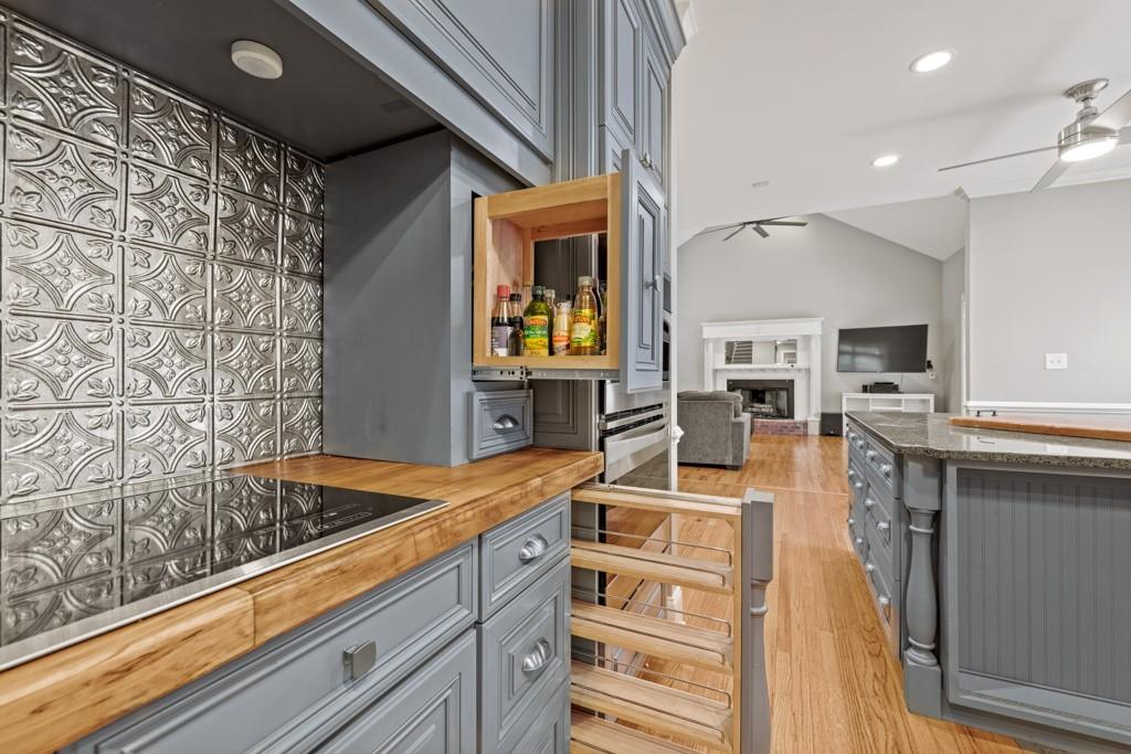 2230 Ewing Chapel Road Dacula, GA 30019 - Photo 13 of 54 a kitchen with stainless steel appliances granite countertop a sink and cabinets