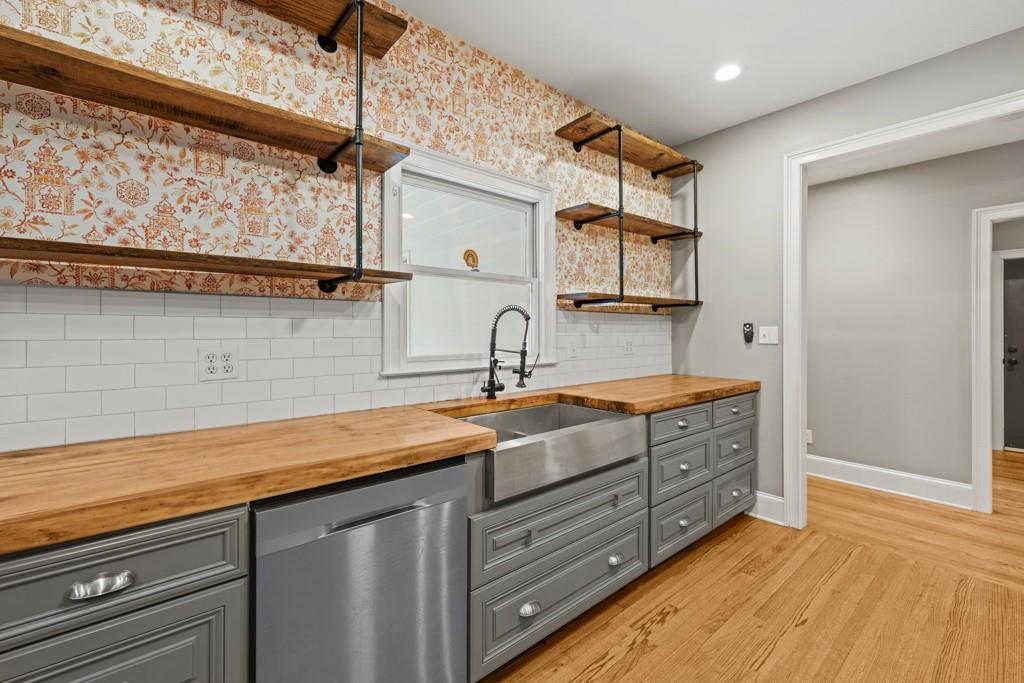 2230 Ewing Chapel Road Dacula, GA 30019 - Photo 16 of 54 a view of two sink and a refrigerator in a kitchen