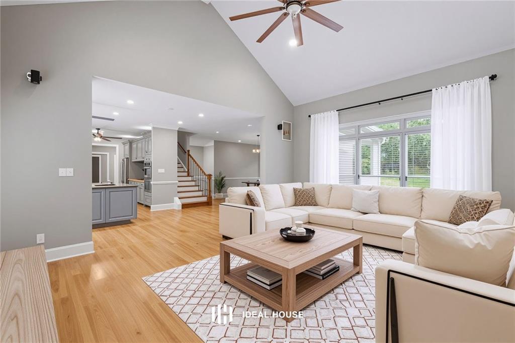 2230 Ewing Chapel Road Dacula, GA 30019 - Photo 18 of 54 a living room with furniture and a large window