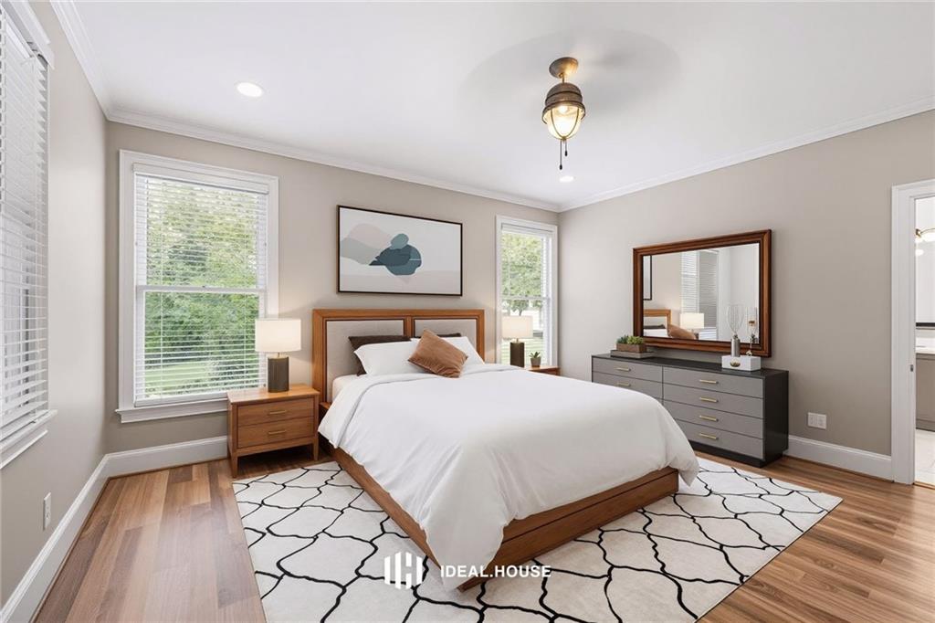 2230 Ewing Chapel Road Dacula, GA 30019 - Photo 22 of 54 a bedroom with a large bed and a window