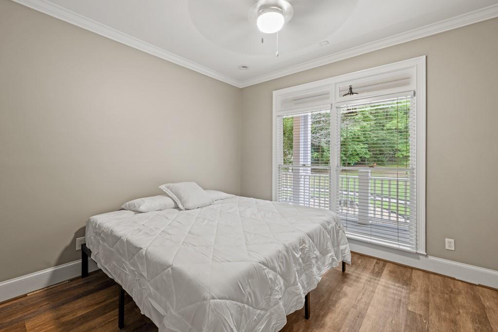 2230 Ewing Chapel Road Dacula, GA 30019 - Photo 23 of 54 a bedroom with a bed and a window