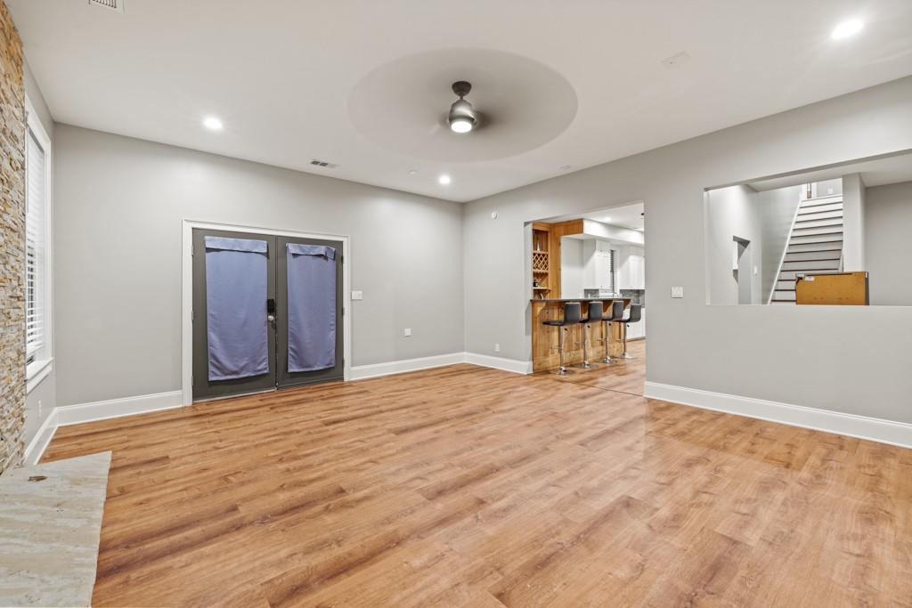 2230 Ewing Chapel Road Dacula, GA 30019 - Photo 26 of 54 a view of an empty room with wooden floor and a window