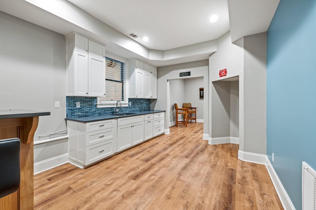 2230 Ewing Chapel Road Dacula, GA 30019 - Photo 27 of 54 a room with a bed and cabinets