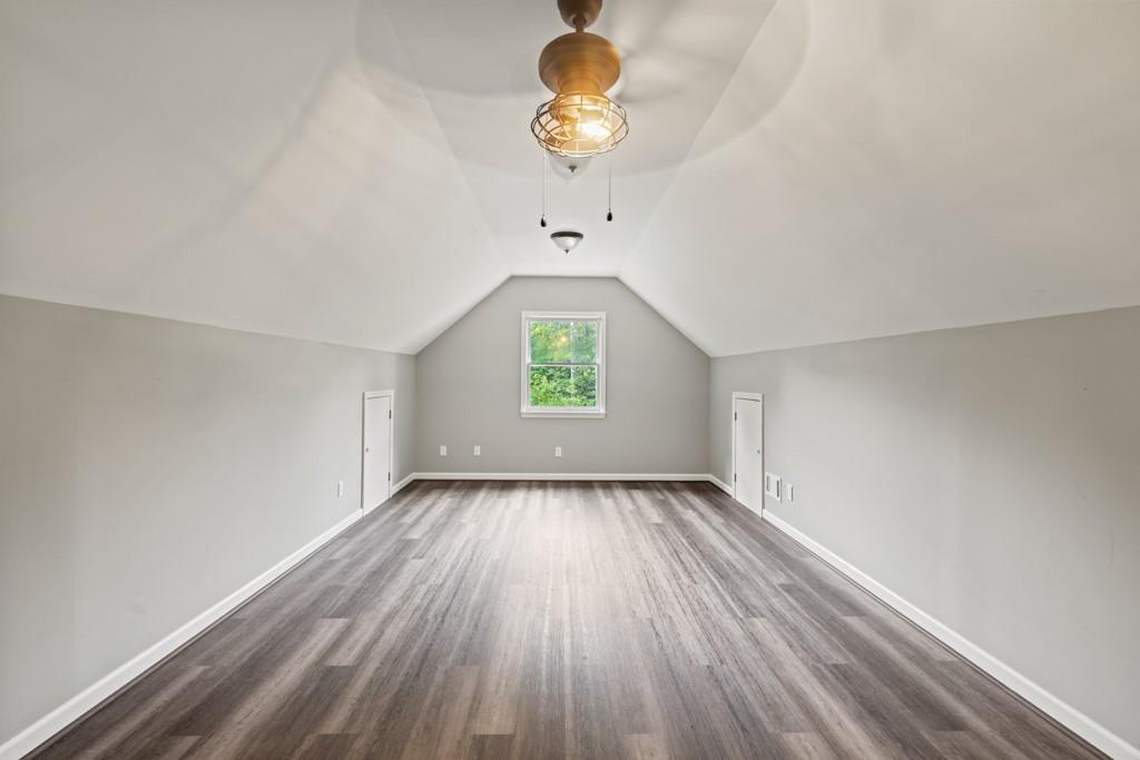 2230 Ewing Chapel Road Dacula, GA 30019 - Photo 38 of 54 wooden floor in an empty room with a window