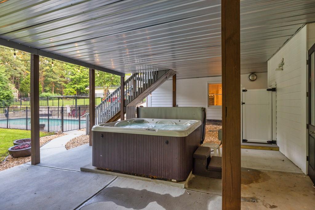 2230 Ewing Chapel Road Dacula, GA 30019 - Photo 40 of 54 a view of a patio with a table and chairs