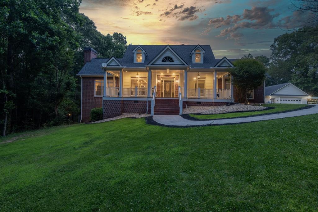 2230 Ewing Chapel Road Dacula, GA 30019 - Photo 4 of 54 a front view of a house with a yard