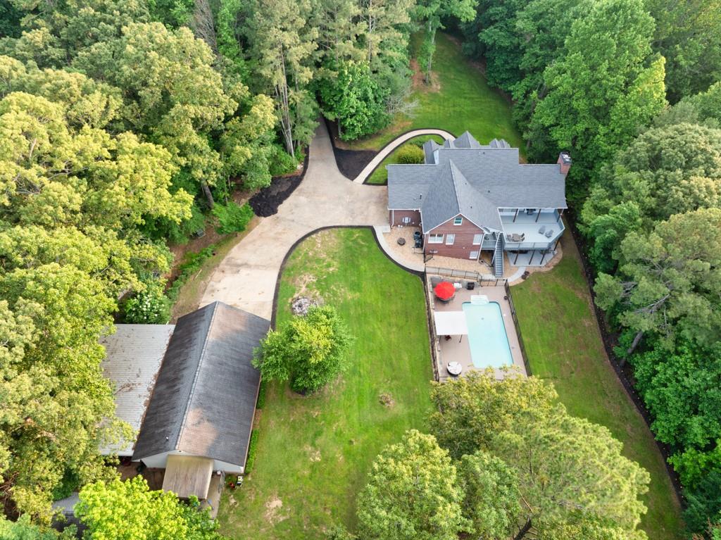 2230 Ewing Chapel Road Dacula, GA 30019 - Photo 45 of 54 an aerial view of a house with outdoor space and trees all around