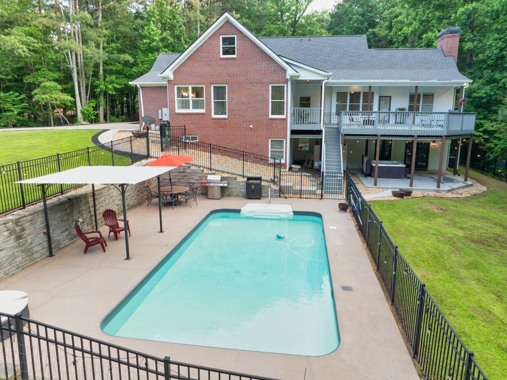 2230 Ewing Chapel Road Dacula, GA 30019 - Photo 46 of 54 a view of a house with a yard patio and sitting area