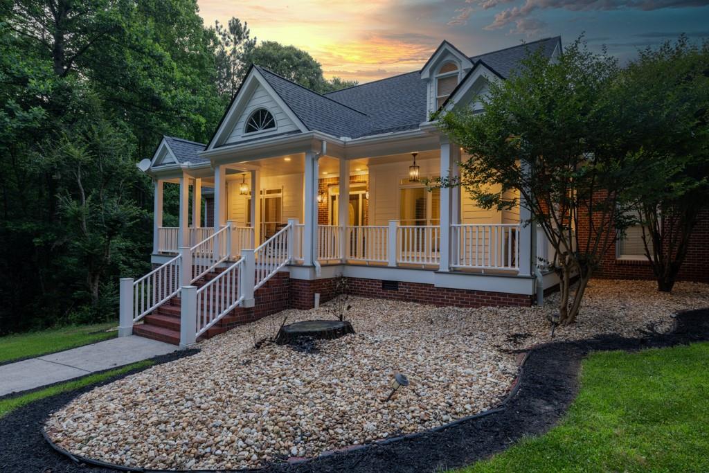 2230 Ewing Chapel Road Dacula, GA 30019 - Photo 5 of 54 a house view with a garden space