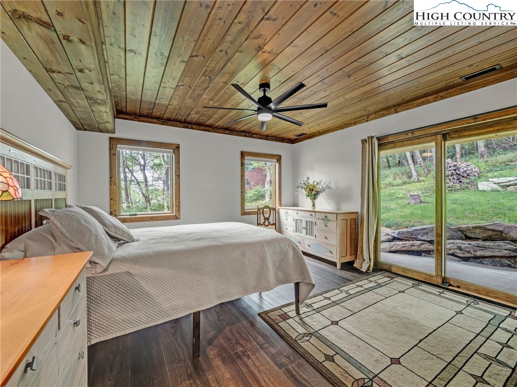 196 Cloud Spring Drive Sugar Mountain, NC 28604 - Photo 26 of 38 a bed room with a bed and a large window