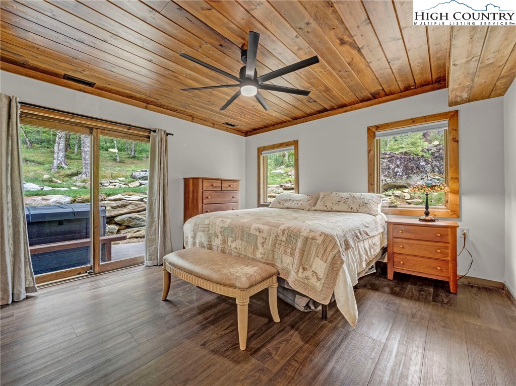 196 Cloud Spring Drive Sugar Mountain, NC 28604 - Photo 29 of 38 a bedroom with a bed and wooden floor
