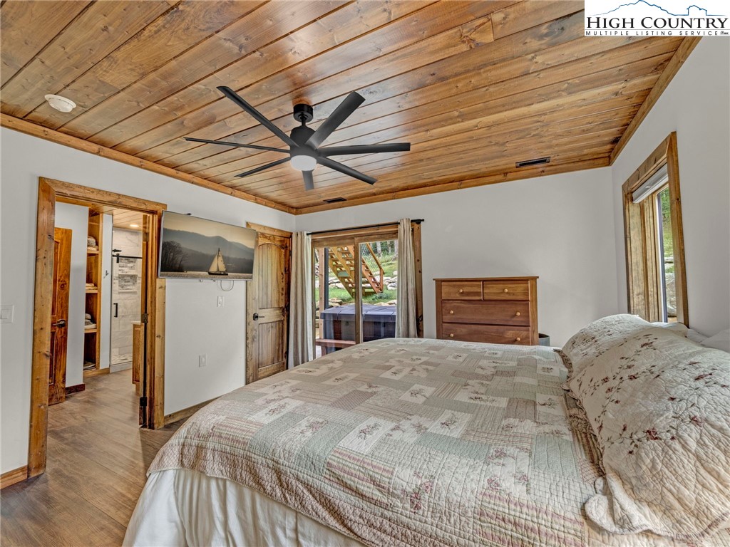 196 Cloud Spring Drive Sugar Mountain, NC 28604 - Photo 30 of 38 a bedroom with a large bed and a window