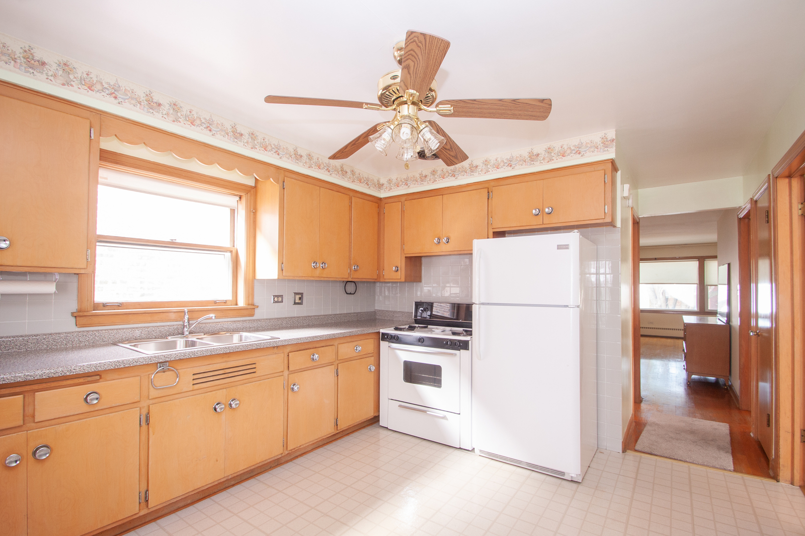 3909 North Spaulding Avenue Chicago, IL 60618 - Photo 12 of 20 a kitchen with appliances a sink and a window