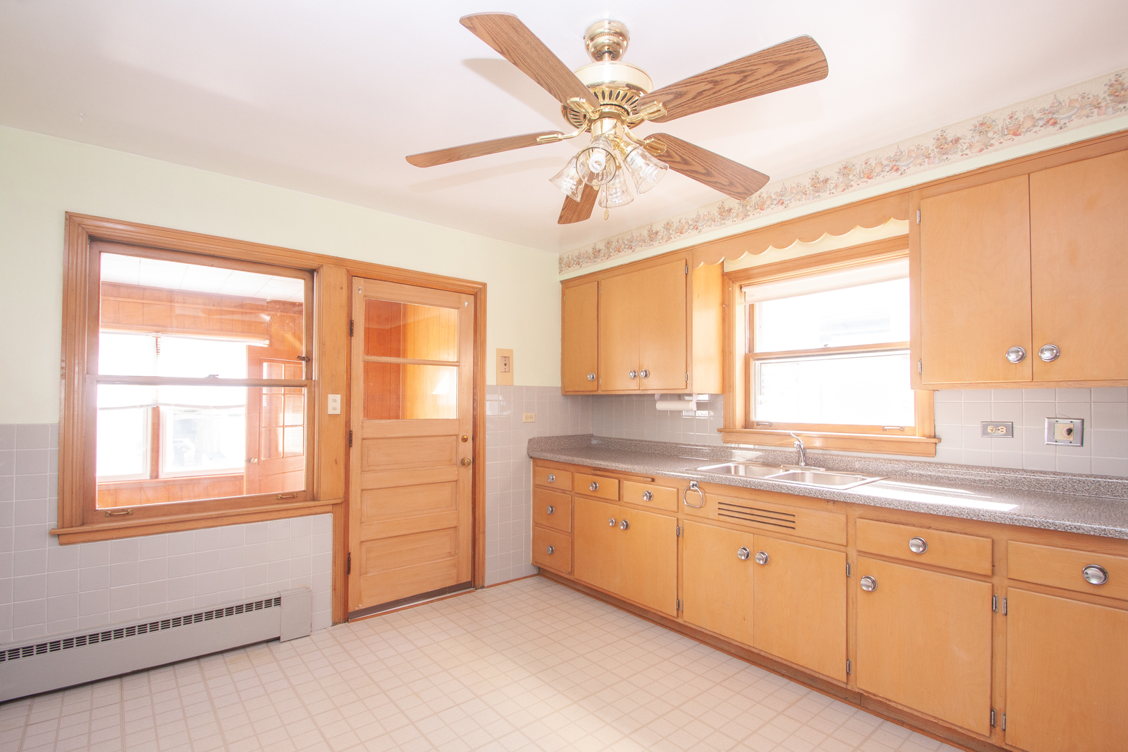 3909 North Spaulding Avenue Chicago, IL 60618 - Photo 13 of 20 a kitchen with a window sink and cabinets