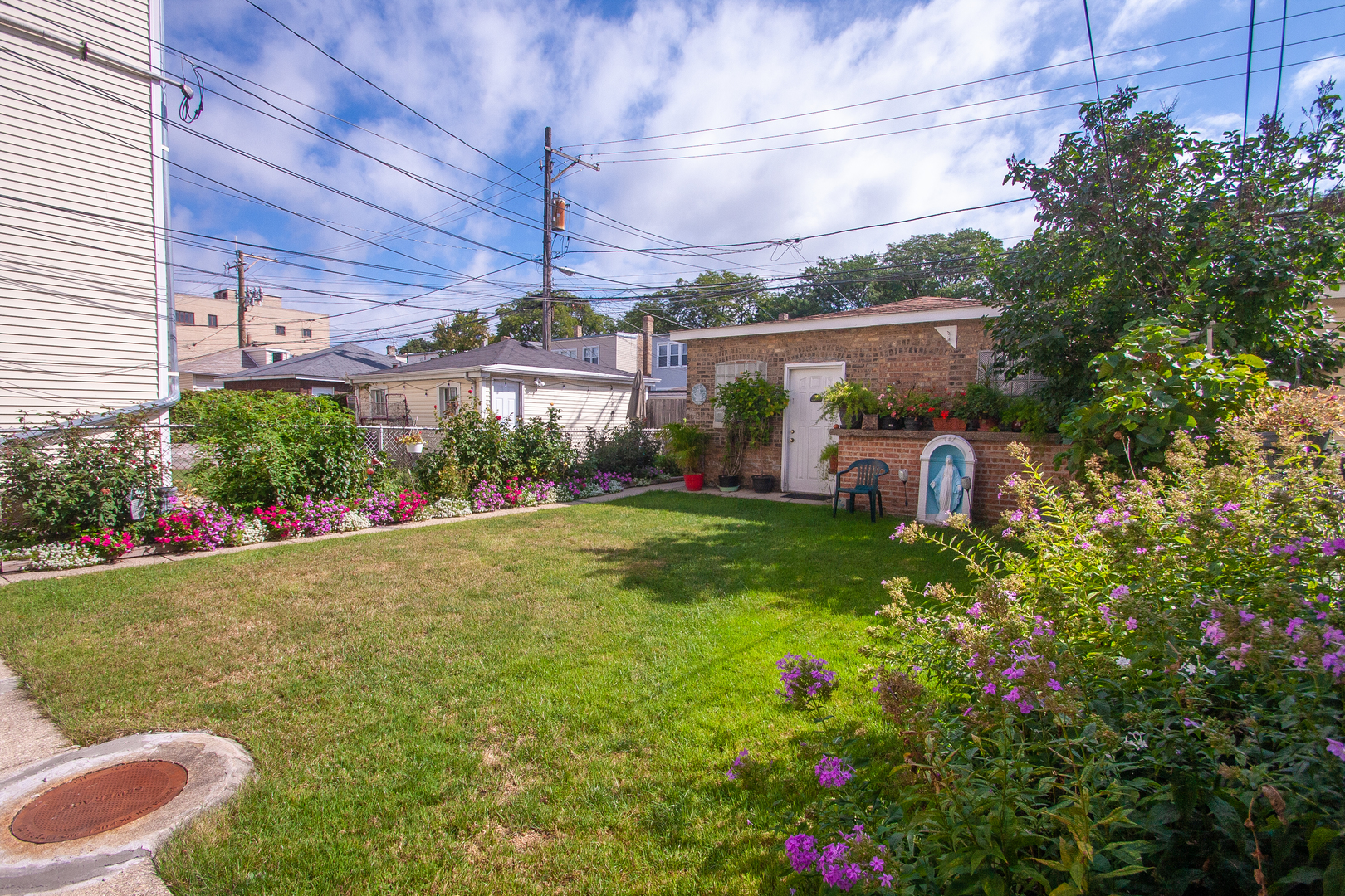 3909 North Spaulding Avenue Chicago, IL 60618 - Photo 19 of 20 a view of a backyard with plants and a garden