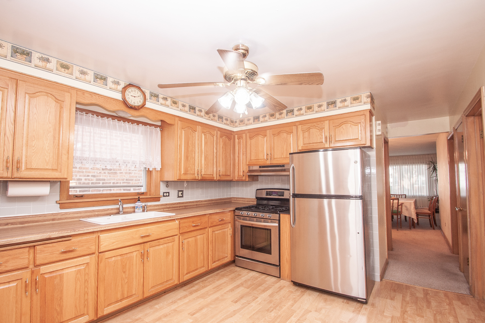 3909 North Spaulding Avenue Chicago, IL 60618 - Photo 5 of 20 a kitchen with appliances a sink and a window