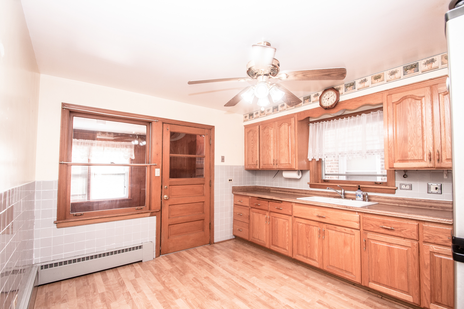 3909 North Spaulding Avenue Chicago, IL 60618 - Photo 6 of 20 a kitchen with a sink window and cabinets