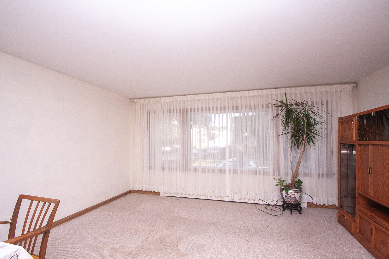 3909 North Spaulding Avenue Chicago, IL 60618 - Photo 10 of 20 a view of a room with gym equipment and floor to ceiling window