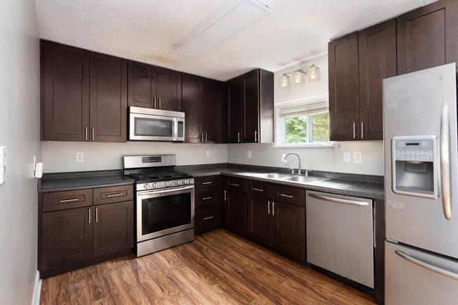 8955 Ochil Lane Winston, GA 30187 - Photo 12 of 31 a kitchen with a sink stove and refrigerator