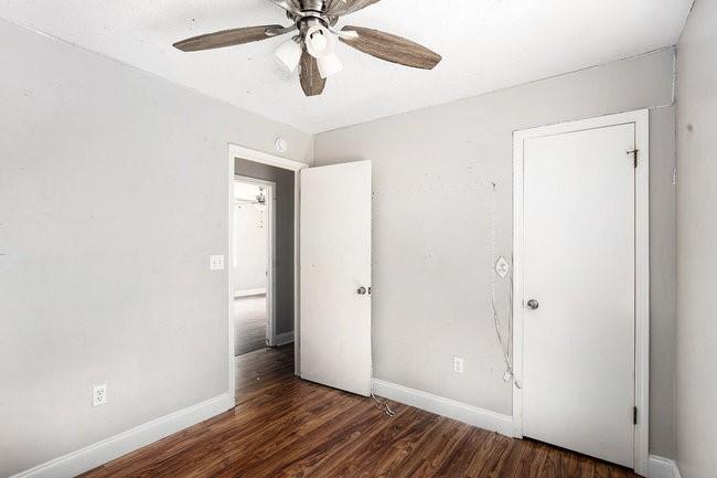 8955 Ochil Lane Winston, GA 30187 - Photo 23 of 31 an empty room with wooden floor closet and fan