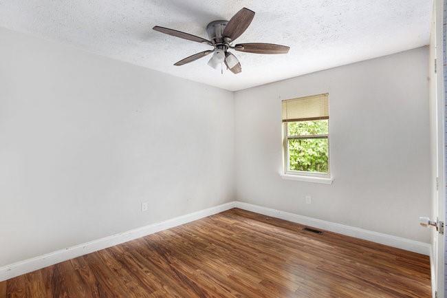 8955 Ochil Lane Winston, GA 30187 - Photo 24 of 31 wooden floor in an empty room with a window