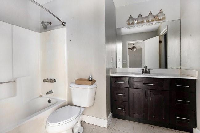 8955 Ochil Lane Winston, GA 30187 - Photo 26 of 31 a bathroom with a toilet sink and mirror