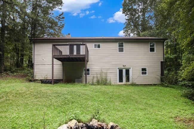 8955 Ochil Lane Winston, GA 30187 - Photo 29 of 31 a front view of a house with a garden