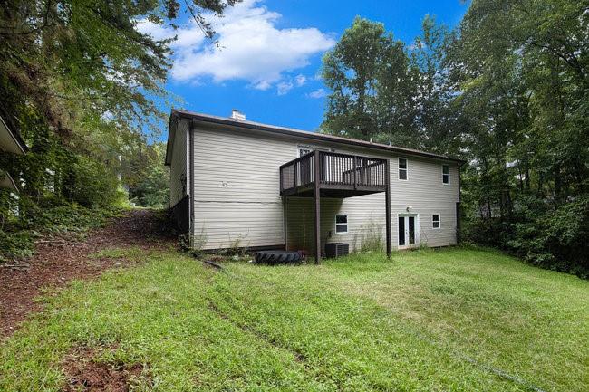 8955 Ochil Lane Winston, GA 30187 - Photo 30 of 31 a view of a house with a yard