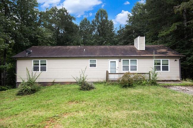 8955 Ochil Lane Winston, GA 30187 - Photo 3 of 31 a view of a house with a yard and plants