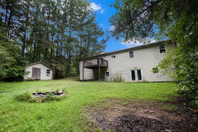 8955 Ochil Lane Winston, GA 30187 - Photo 31 of 31 a house that is sitting in the forest