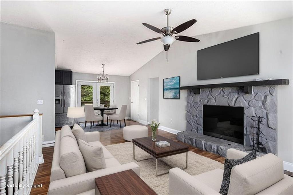 8955 Ochil Lane Winston, GA 30187 - Photo 4 of 31 a living room with furniture a flat screen tv and a fireplace